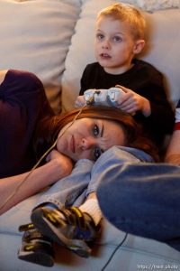 Trent Nelson  |  The Salt Lake Tribune
After a long day of school and work, Jen Carver rests while her son T.J. plays videogames Thursday, March 29, 2012 in Ogden, Utah. U.S. Army veteran Jen Carver served two tours in Iraq and is now a full time college student with an on-campus job while raising her 4-year-old son. After a long day of school and work, Carver keeps her evenings as, 