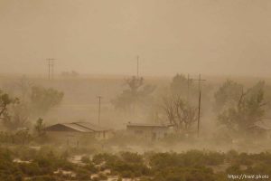 Trent Nelson  |  The Salt Lake City A dust storm blows through the lonely town of Woodside, Utah on Wednesday, August 1, 2012.