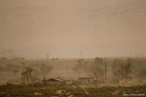 Trent Nelson  |  The Salt Lake City A dust storm blows through the lonely town of Woodside, Utah on Wednesday, August 1, 2012.