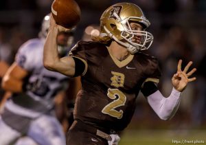 Trent Nelson  |  The Salt Lake Tribune Davis quarterback Mickey Navidomskis throws the ball on the run as Davis hosts Syracuse High School football in Kaysville, Utah, Friday, September 14, 2012.