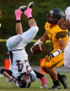 Trent Nelson  |  The Salt Lake Tribune
Jordan's Cooper Clark flips while stopping Cottonwood's Gabe Hosea as Cottonwood hosts Jordan High School football, Friday October 5, 2012.