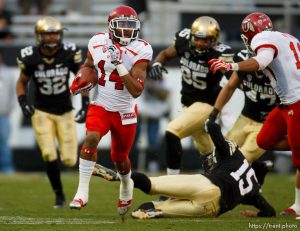 Trent Nelson  |  The Salt Lake Tribune Utah Utes wide receiver Reggie Dunn (14) returns a kick for a touchdown in the fourth quarter as the Colorado Buffaloes host the University of Utah Utes, college football Friday November 23, 2012 in Boulder.
