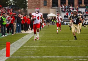 Trent Nelson  |  The Salt Lake Tribune Utah Utes wide receiver Reggie Dunn (14) returns a kick for a touchdown in the fourth quarter as the Colorado Buffaloes host the University of Utah Utes, college football Friday November 23, 2012 in Boulder.