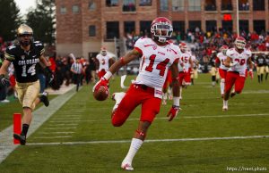 Trent Nelson  |  The Salt Lake Tribune Utah Utes wide receiver Reggie Dunn (14) returns a kick for a touchdown in the fourth quarter as the Colorado Buffaloes host the University of Utah Utes, college football Friday November 23, 2012 in Boulder.