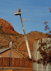 Trent Nelson  |  The Salt Lake Tribune A young boy on a cherry picker Thursday November 29, 2012 in Hildale.