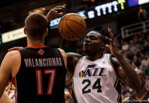 Trent Nelson  |  The Salt Lake Tribune
Utah Jazz power forward Paul Millsap (24) pulls down a rebound ahead of Toronto Raptors center Jonas Valanciunas (17) as the Utah Jazz face the Toronto Raptors Friday December 7, 2012.