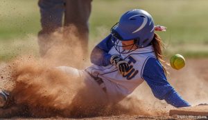 Trent Nelson  |  The Salt Lake Tribune Taylorsville's Korlee Jensen slides into second as Taylorsville defeats West High School softball, Thursday April 18, 2013 in Taylorsville.
