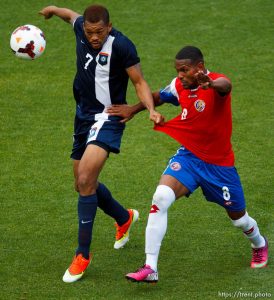 Trent Nelson  |  The Salt Lake Tribune Belize's Ian Gaynair chases the ball with Costa Rica's Kenny Cunningham defending as Costa Rica defeats Belize 1-0 in CONCACAF Gold Cup soccer at Rio Tinto Stadium in Sandy, Saturday July 13, 2013.