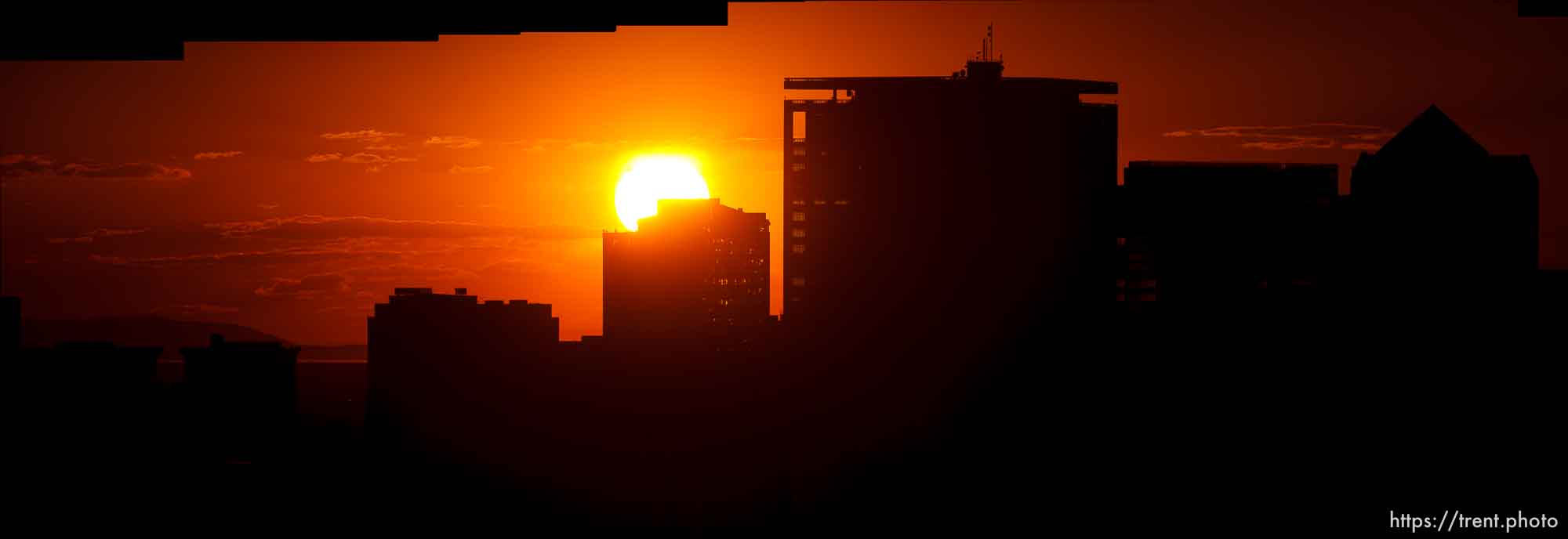 Trent Nelson  |  The Salt Lake Tribune The sun sets over a smoky Salt Lake City skyline Sunday August 11, 2013.