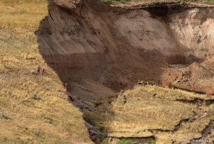 Trent Nelson  |  The Salt Lake Tribune Workers inspecting a large mudslide in North Salt Lake that destroyed one home and caused the evacuation of dozens more, Tuesday August 5, 2014.