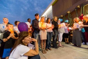 Trent Nelson  |  The Salt Lake Tribune Susan Hunt, lower left, listens to stories about her son, Darrien Hunt, at a candlelight vigil Sunday September 14, 2014 for Darrien, who was shot and killed by Saratoga Springs police.