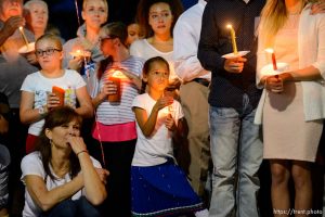 Trent Nelson  |  The Salt Lake Tribune Susan Hunt, lower left, listens to stories about her son, Darrien Hunt, at a candlelight vigil Sunday September 14, 2014 for Darrien, who was shot and killed by Saratoga Springs police.