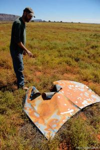 Trent Nelson  |  The Salt Lake Tribune Andrew Chatwin points to the hood of a truck that was bombed, in Colorado City, Arizona, Thursday September 25, 2014.