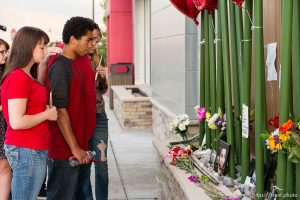 Trent Nelson  |  The Salt Lake Tribune Family and friends at a memorial to Darrien Hunt Sunday September 14, 2014 at the Saratoga Springs Panda Express, where Hunt was shot and killed by police.