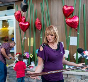 Trent Nelson  |  The Salt Lake Tribune Cindy Moss, Darrien Hunt's aunt, holds a wooden sword at a memorial to Darrien Sunday September 14, 2014 at the Saratoga Springs Panda Express where Hunt was shot and killed by police.