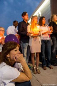 Trent Nelson  |  The Salt Lake Tribune Susan Hunt, lower left, listens to stories about her son, Darrien Hunt, at a candlelight vigil Sunday September 14, 2014 for Darrien, who was shot and killed by Saratoga Springs police.