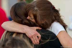 Trent Nelson  |  The Salt Lake Tribune Susan Hunt embraces a friend during a candlelight vigil Sunday September 14, 2014 for her son, Darrien Hunt, who was shot and killed by Saratoga Springs police.