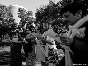 Trent Nelson  |  The Salt Lake Tribune A group of people sing an LDS hymn before entering a broadcast of the LDS General Priesthood Session at BYU's Marriott Center in Provo Saturday October 4, 2014. The event was one of several planned by Ordain Women.