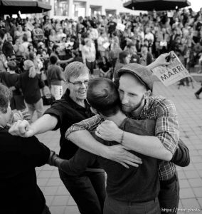 Trent Nelson  |  The Salt Lake Tribune Debbie Johnson rushes in to embrace Kitchen v. Herbert plaintiffs Derek Kitchen and Moudi Sbeity at a rally to celebrate today's legalization of same-sex marriage, Monday October 6, 2014 in Salt Lake City.