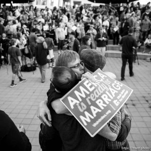 Trent Nelson  |  The Salt Lake Tribune Debbie Johnson embraces Kitchen v. Herbert plaintiffs Derek Kitchen and Moudi Sbeity at a rally to celebrate today's legalization of same-sex marriage, Monday October 6, 2014 in Salt Lake City.