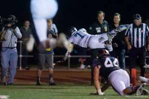 Trent Nelson  |  The Salt Lake Tribune Corner Canyon quarterback Michael Ebeling dives into the end zone for a two-point conversion and the win over Woods Cross High School football, in Woods Cross, Wednesday October 15, 2014.