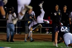 Trent Nelson  |  The Salt Lake Tribune Corner Canyon quarterback Michael Ebeling dives into the end zone for a two-point conversion and the win over Woods Cross High School football, in Woods Cross, Wednesday October 15, 2014.