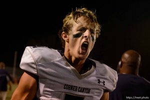Trent Nelson  |  The Salt Lake Tribune Corner Canyon quarterback Michael Ebeling celebrates after diving into the end zone for a two-point conversion and the win over Woods Cross High School football, in Woods Cross, Wednesday October 15, 2014.