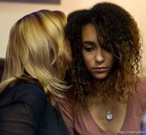 Trent Nelson  |  The Salt Lake Tribune Cindy Moss comforts her neice, Aliya Hunt, sister of Darrien Hunt, during at a press conference in Salt Lake City, Friday October 17, 2014. An autopsy report released Friday says Darrien Hunt was shot several times in the back by Saratoga Springs police officers chasing him.