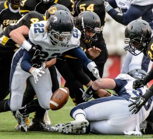 Trent Nelson  |  The Salt Lake Tribune Corner Canyon's Matthew Ogden reaches out to recover his own fumble as Corner Canyon faces Roy High School in a  4A state football semifinal game at Rice-Eccles Stadium in Salt Lake City, Friday November 14, 2014.