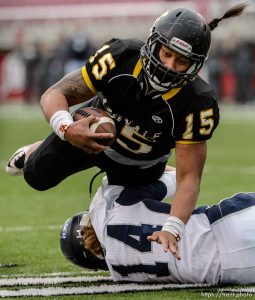 Trent Nelson  |  The Salt Lake Tribune Roy's Baby Eteuati runs into Corner Canyon's Garrett Michaeli as Roy defeats Corner Canyon High School in a 4A state football semifinal game at Rice-Eccles Stadium in Salt Lake City, Friday November 14, 2014.