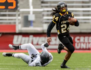 Trent Nelson  |  The Salt Lake Tribune Roy's Tyler Eteuati runs the ball as Roy defeats Corner Canyon High School in a 4A state football semifinal game at Rice-Eccles Stadium in Salt Lake City, Friday November 14, 2014.