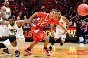 Trent Nelson  |  The Salt Lake Tribune Alabama State Hornets center Wendell Lewis (00) holds onto Utah Utes guard Kenneth Ogbe (25) as the University of Utah Utes host the Alabama State Hornets, college basketball at the Huntsman Center in Salt Lake City, Saturday November 29, 2014.