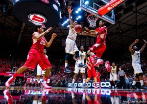 Trent Nelson  |  The Salt Lake Tribune Utah Utes guard Kenneth Ogbe (25) passes to forward Chris Reyes (20) as Alabama State Hornets guard Bobby Brown (5) defends as the University of Utah Utes host the Alabama State Hornets, college basketball at the Huntsman Center in Salt Lake City, Saturday November 29, 2014.