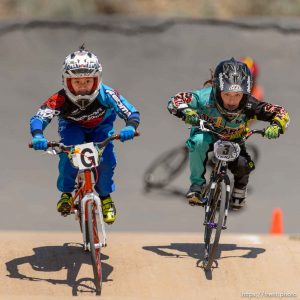 Trent Nelson  |  The Salt Lake Tribune 9-year-old girls Gianna Davila, left, and Stella Sunseri race at the U.S. BMX National Series at Rad Canyon BMX in South Jordan, Saturday June 13, 2015.