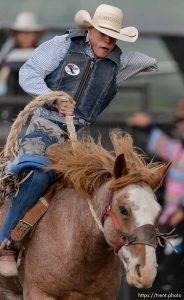 Trent Nelson  |  The Salt Lake Tribune Nathan Urie competes in Saddle Bronc at the Utah High School Rodeo Association state championships in Heber, Saturday June 6, 2015.