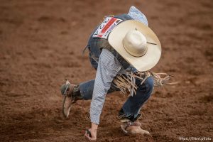 Trent Nelson  |  The Salt Lake Tribune Nathan Urie gets up after competing in Saddle Bronc at the Utah High School Rodeo Association state championships in Heber, Saturday June 6, 2015.