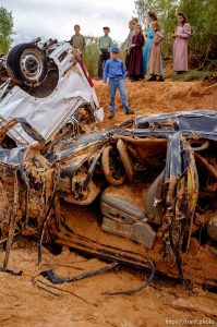 Trent Nelson  |  The Salt Lake Tribune
Children take in the scene in a Hildale wash where two vehicles came to rest after a flash flood that killed nine people (with four still missing) Tuesday September 15, 2015., the day after an SUV and a van were washed off a road during a flash flood in this polygamous Utah-Arizona border community.