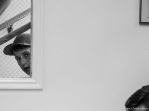 Trent Nelson  |  The Salt Lake Tribune Boy looks in, Flash flood press conference at Colorado City Hall, Tuesday September 15, 2015. Eight people had died and five remained missing Tuesday morning, the day after an SUV and a van were washed off a road during a flash flood in this polygamous Utah-Arizona border community.