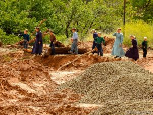 Trent Nelson  |  The Salt Lake Tribune People take in the scene in a Hildale wash where a flash flood killed nine people (with four still missing) Tuesday September 15, 2015., the day after an SUV and a van were washed off a road during a flash flood in this polygamous Utah-Arizona border community.
