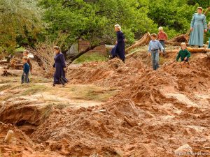 Trent Nelson  |  The Salt Lake Tribune People take in the scene in a Hildale wash where a flash flood killed nine people (with four still missing) Tuesday September 15, 2015., the day after an SUV and a van were washed off a road during a flash flood in this polygamous Utah-Arizona border community.
