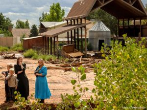 Trent Nelson  |  The Salt Lake Tribune People take in the scene in a Hildale wash where a flash flood killed nine people (with four still missing) Tuesday September 15, 2015., the day after an SUV and a van were washed off a road during a flash flood in this polygamous Utah-Arizona border community.