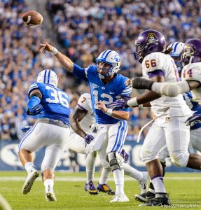 Trent Nelson  |  The Salt Lake Tribune Brigham Young Cougars quarterback Tanner Mangum (12) passes to Brigham Young Cougars wide receiver Terenn Houk (11) for a first half touchdown as BYU hosts East Carolina, college football at LaVell Edwards Stadium in Provo, Saturday October 10, 2015.