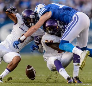 Trent Nelson  |  The Salt Lake Tribune Brigham Young Cougars wide receiver Mitch Mathews (10), defended by East Carolina Pirates defensive back Travon Simmons (3) and East Carolina Pirates defensive back Josh Hawkins (28) as BYU hosts East Carolina, college football at LaVell Edwards Stadium in Provo, Saturday October 10, 2015.