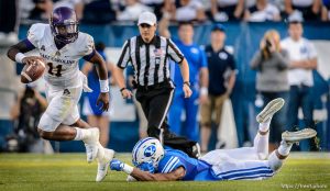 Trent Nelson  |  The Salt Lake Tribune East Carolina Quarterback Cody Keith scrambles away from Brigham Young Cougars linebacker Fred Warner (4) as BYU hosts East Carolina, college football at LaVell Edwards Stadium in Provo, Saturday October 10, 2015.