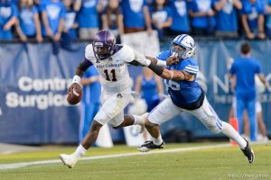 Trent Nelson  |  The Salt Lake Tribune East Carolina Quarterback Cody Keith scrambles away from Brigham Young Cougars linebacker Sione Takitaki (16) as BYU hosts East Carolina, college football at LaVell Edwards Stadium in Provo, Saturday October 10, 2015.