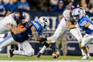 Trent Nelson  |  The Salt Lake Tribune Brigham Young Cougars linebacker Sione Takitaki (16) recovers a fumble as BYU hosts East Carolina, college football at LaVell Edwards Stadium in Provo, Saturday October 10, 2015.