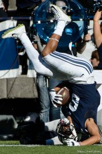 Trent Nelson  |  The Salt Lake Tribune Wagner Seahawks linebacker Nick Menocal (17) brings down Brigham Young Cougars wide receiver Trey Dye (6) as BYU hosts Wagner, NCAA football at LaVell Edwards Stadium in Provo, Saturday October 24, 2015.