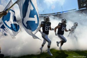Trent Nelson  |  The Salt Lake Tribune cougars take field through fog and flags as BYU hosts Wagner, NCAA football at LaVell Edwards Stadium in Provo, Saturday October 24, 2015.