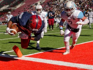 Trent Nelson  |  The Salt Lake Tribune Herriman's Jake Jutkins (26) dives into the end zone for a touchdown, as Sky View faces Herriman in a 5A high school football semifinal game at Rice-Eccles Stadium in Salt Lake City, Friday November 13, 2015.