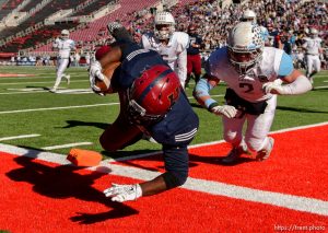 Trent Nelson  |  The Salt Lake Tribune Herriman's Jake Jutkins (26) dives into the end zone for a touchdown, as Sky View faces Herriman in a 5A high school football semifinal game at Rice-Eccles Stadium in Salt Lake City, Friday November 13, 2015.